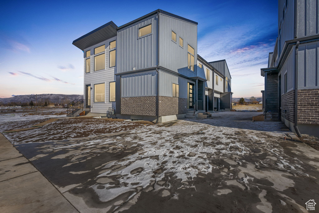 View of property exterior at dusk