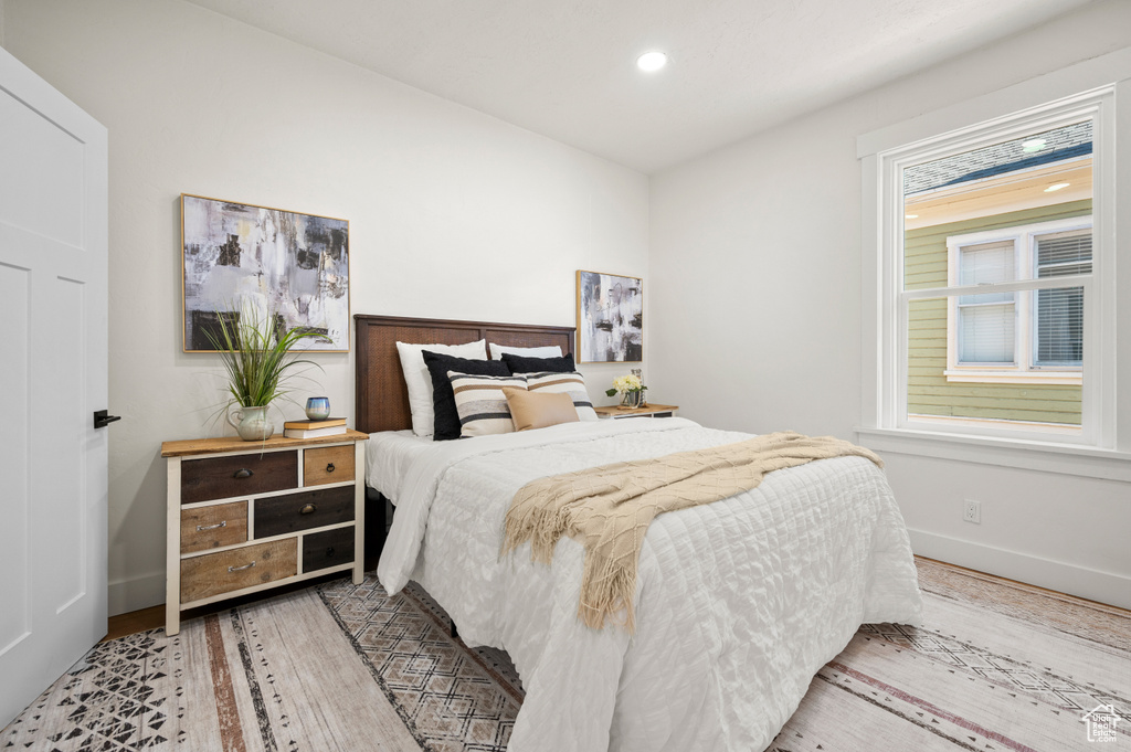 Bedroom featuring wood finished floors and recessed lighting
