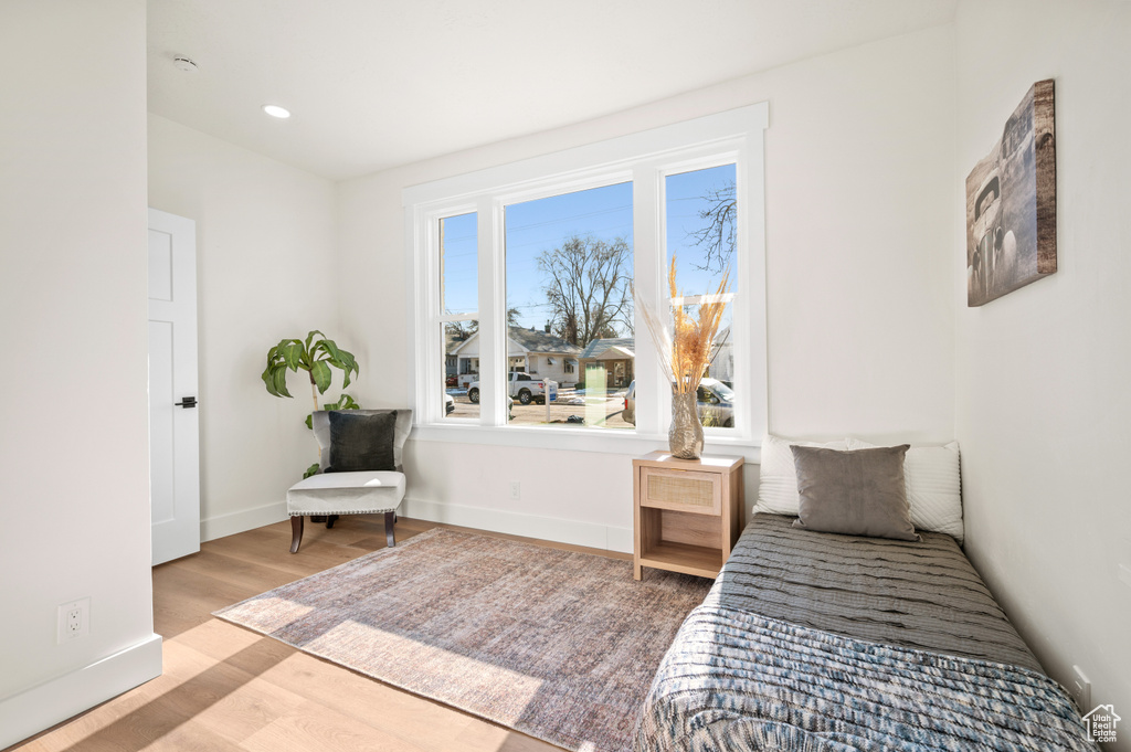 Bedroom with light wood-type flooring and recessed lighting