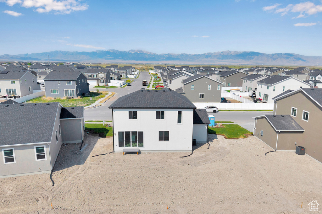 Aerial perspective of suburban area with mountains