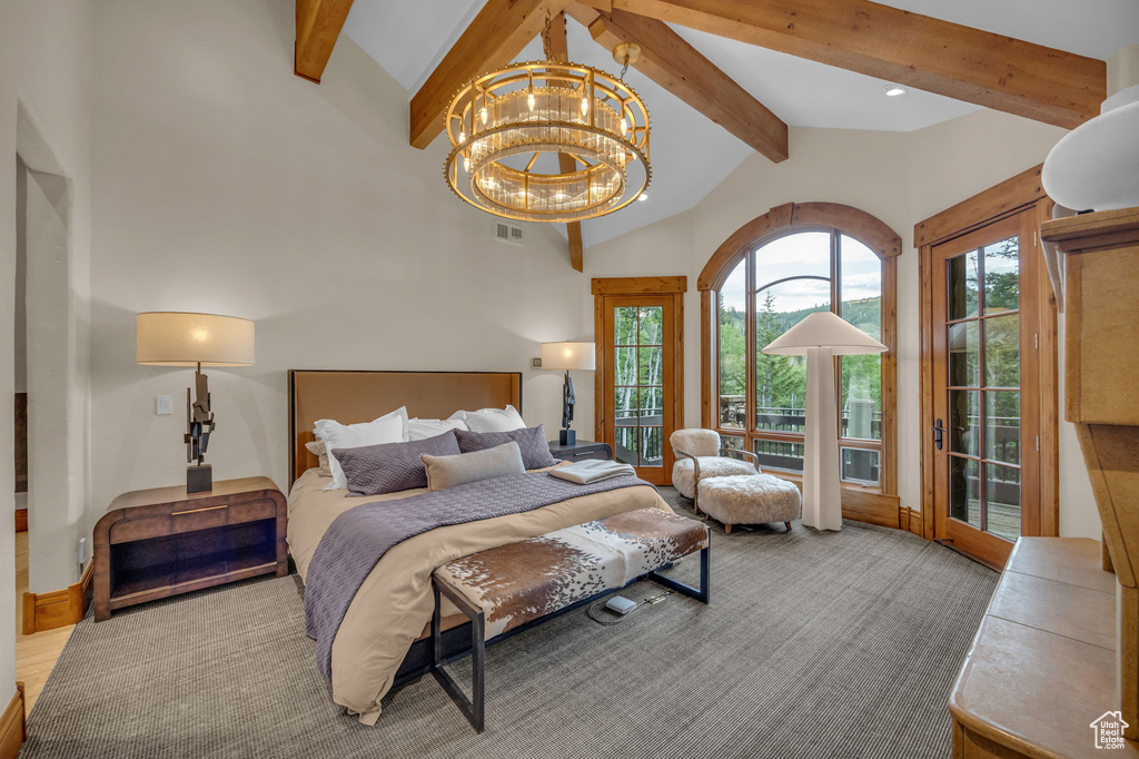 Bedroom featuring access to outside, a chandelier, and carpet floors