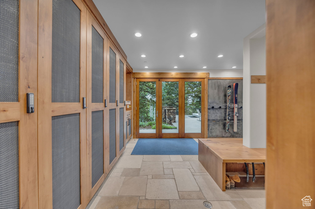 Foyer featuring stone tile flooring, recessed lighting, and a heating unit