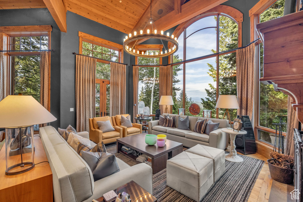 Sunroom / solarium featuring a chandelier and healthy amount of natural light