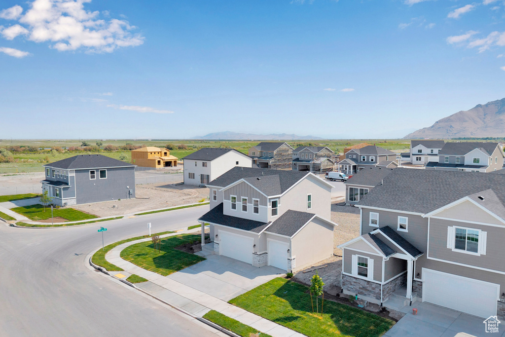 Aerial perspective of suburban area with a mountainous background