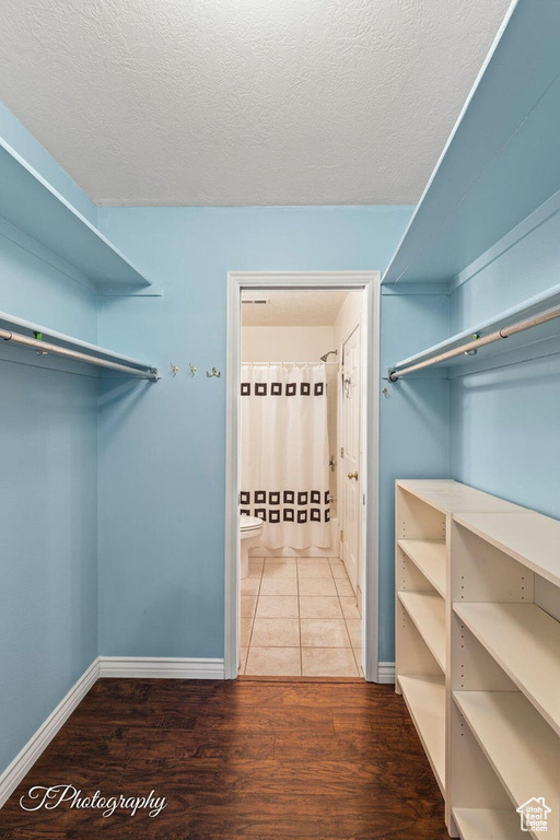 Spacious closet featuring wood-type flooring