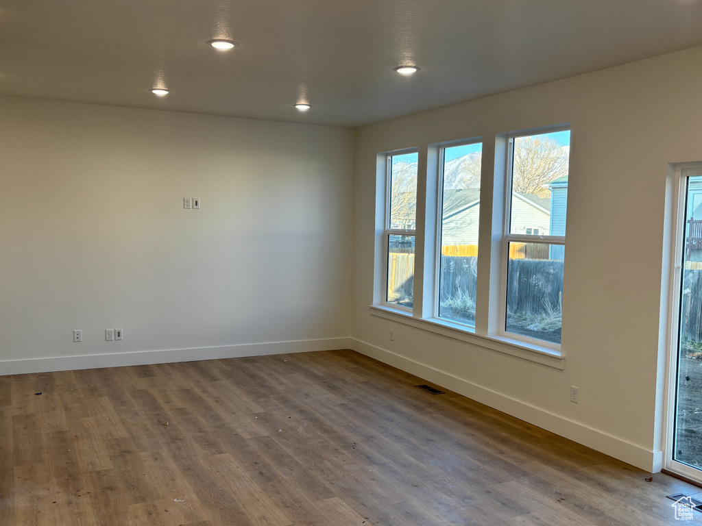 Unfurnished room featuring wood-type flooring