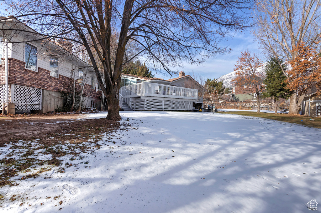 View of yard covered in snow