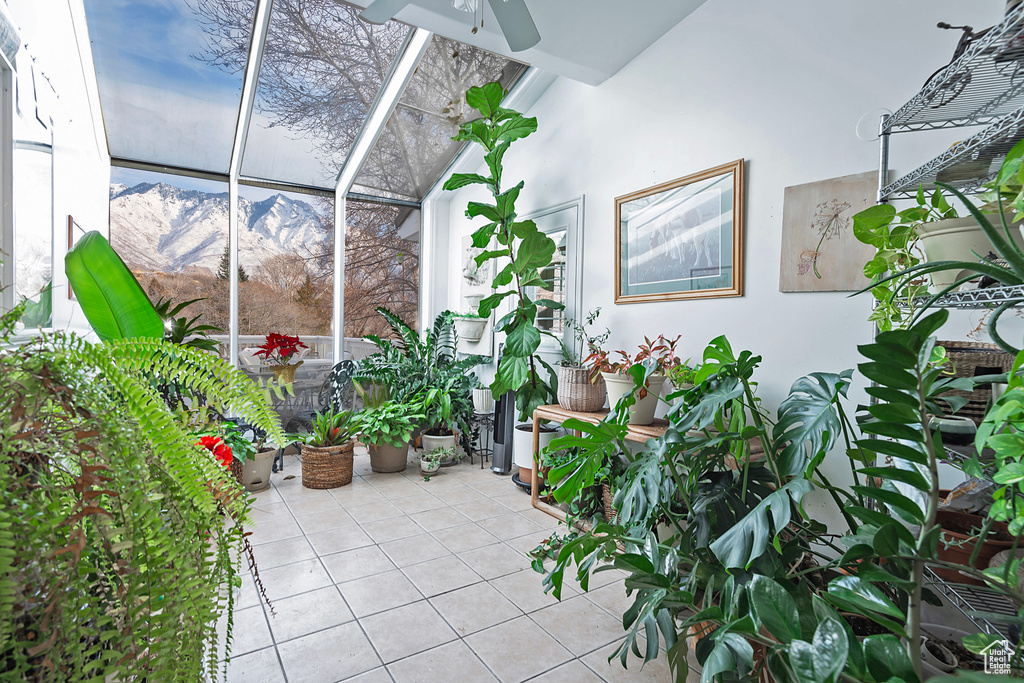 Interior space featuring a patio area, a mountain view, and ceiling fan