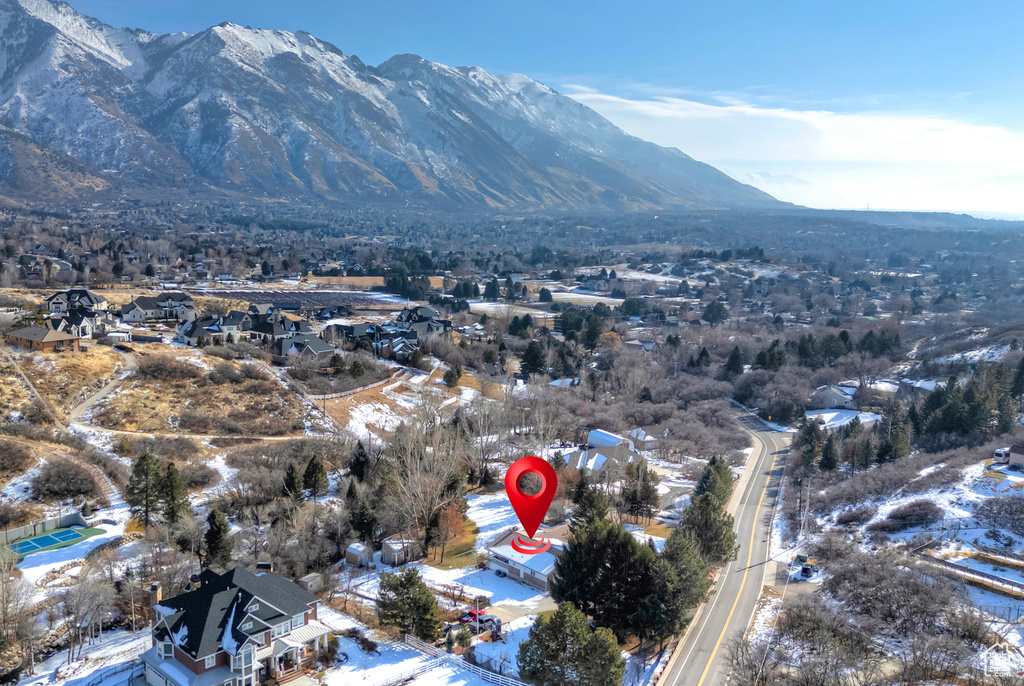 Snowy aerial view with a mountain view