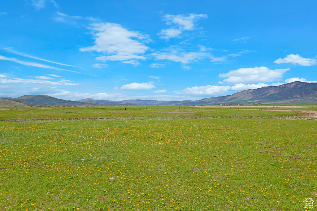 View of mountain backdrop featuring rural landscape