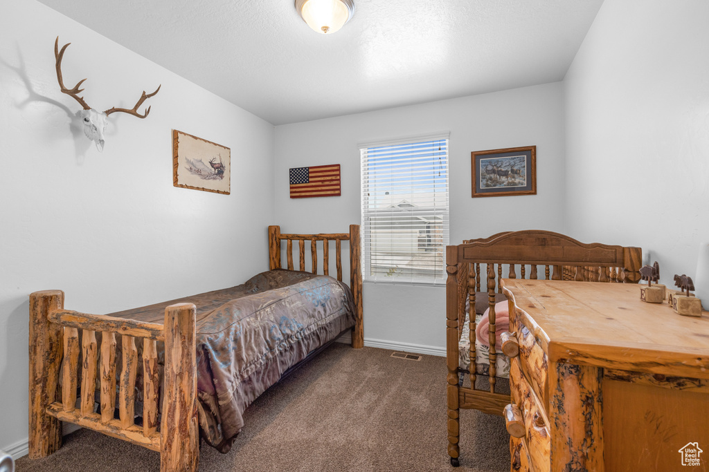 Bedroom featuring carpet flooring