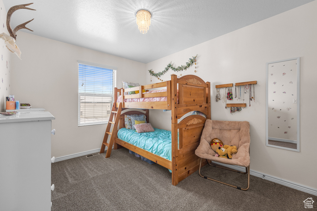Bedroom with dark carpet