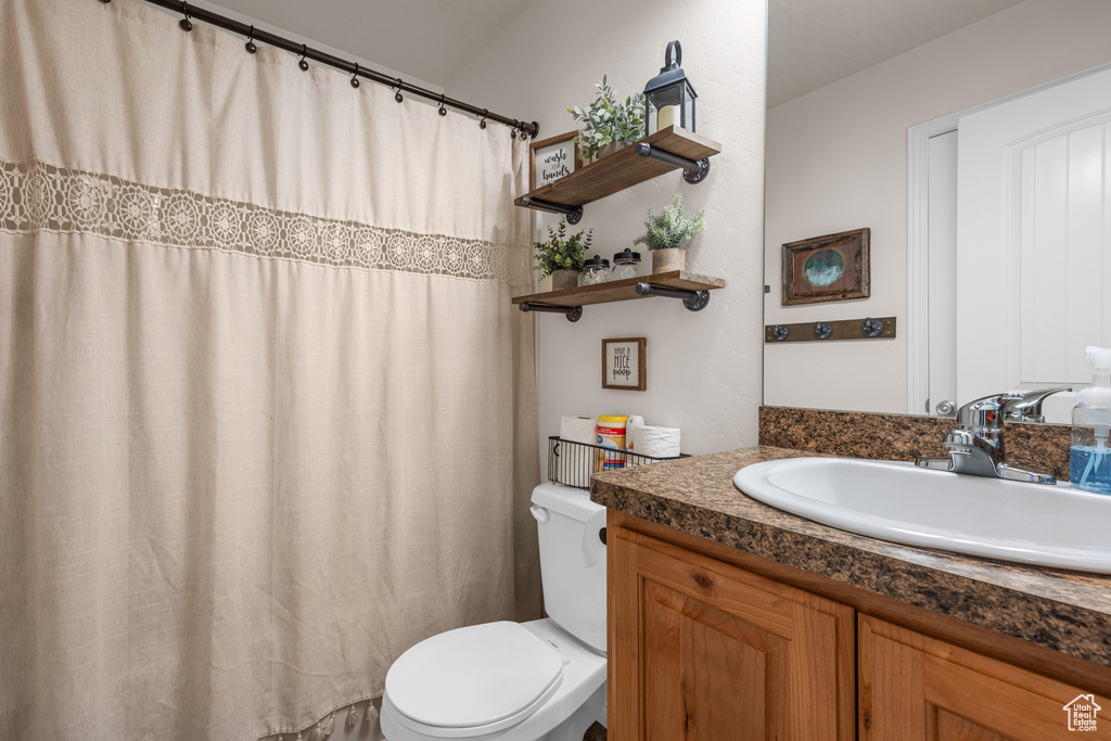 Bathroom featuring toilet and vanity
