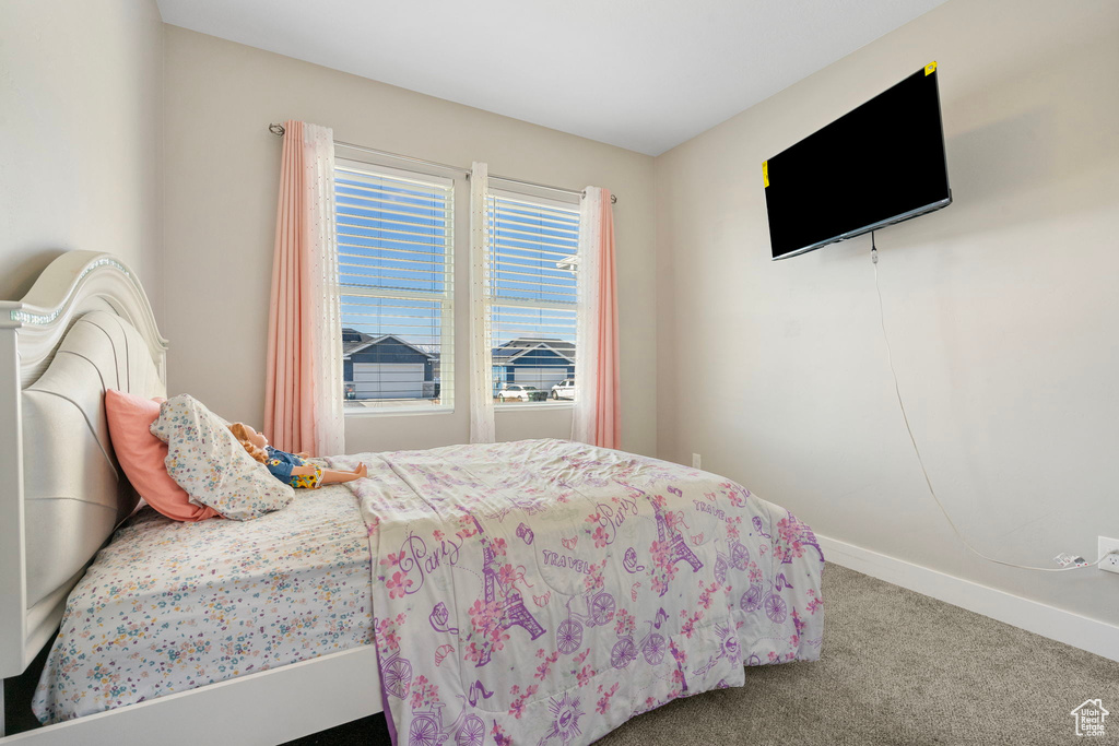 Bedroom featuring carpet floors