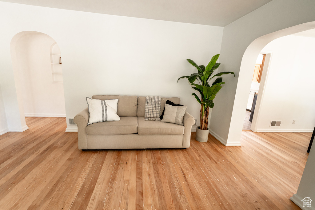 Living room with wood-type flooring