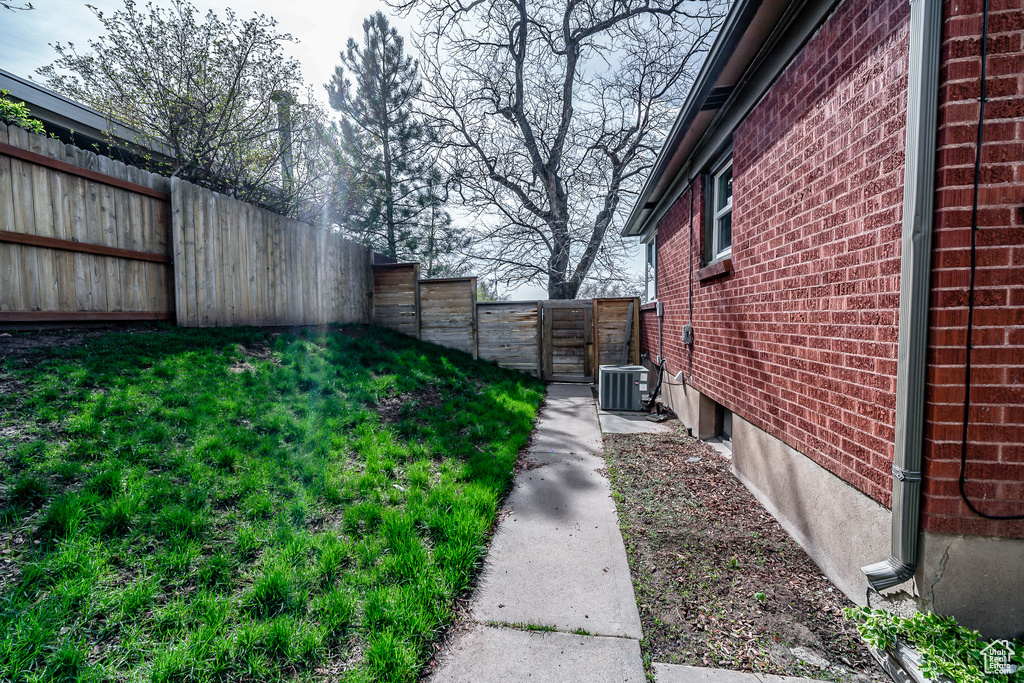 View of yard with central AC