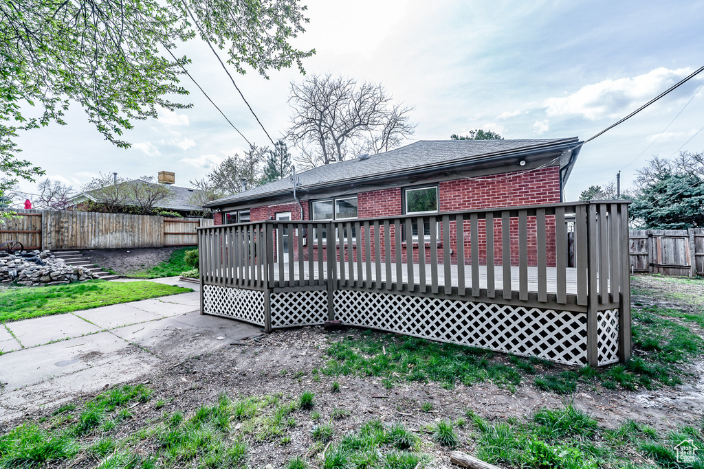 Rear view of property with a deck