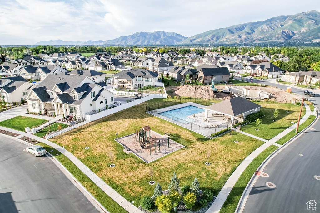 Aerial view of residential area featuring a mountainous background