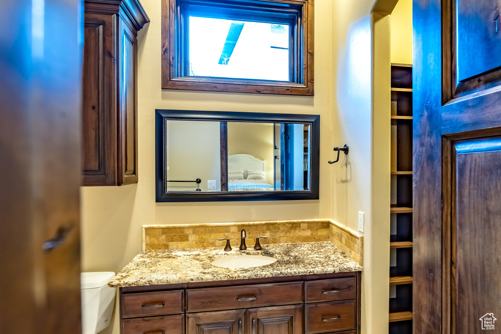 Bathroom featuring toilet and vanity