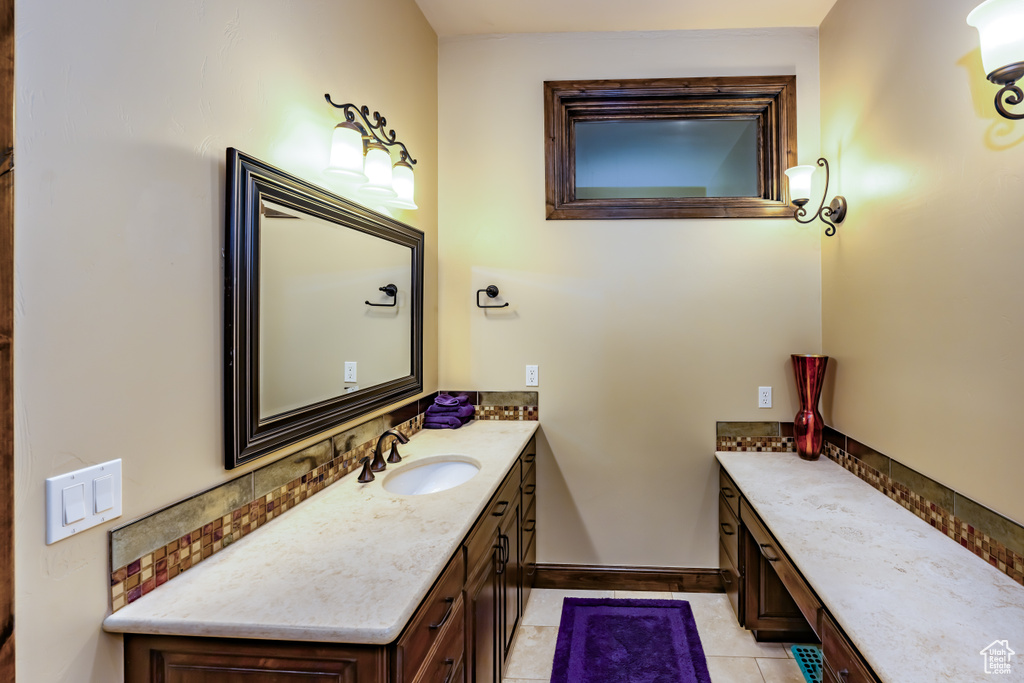 Bathroom with vanity and tile patterned flooring