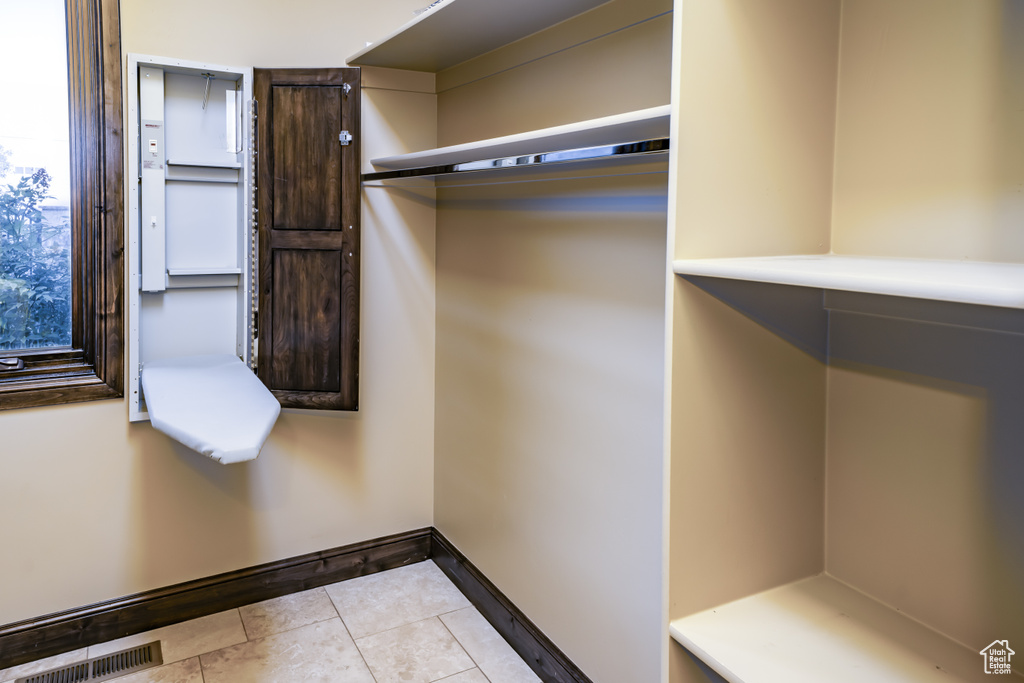 Walk in closet featuring light tile patterned floors