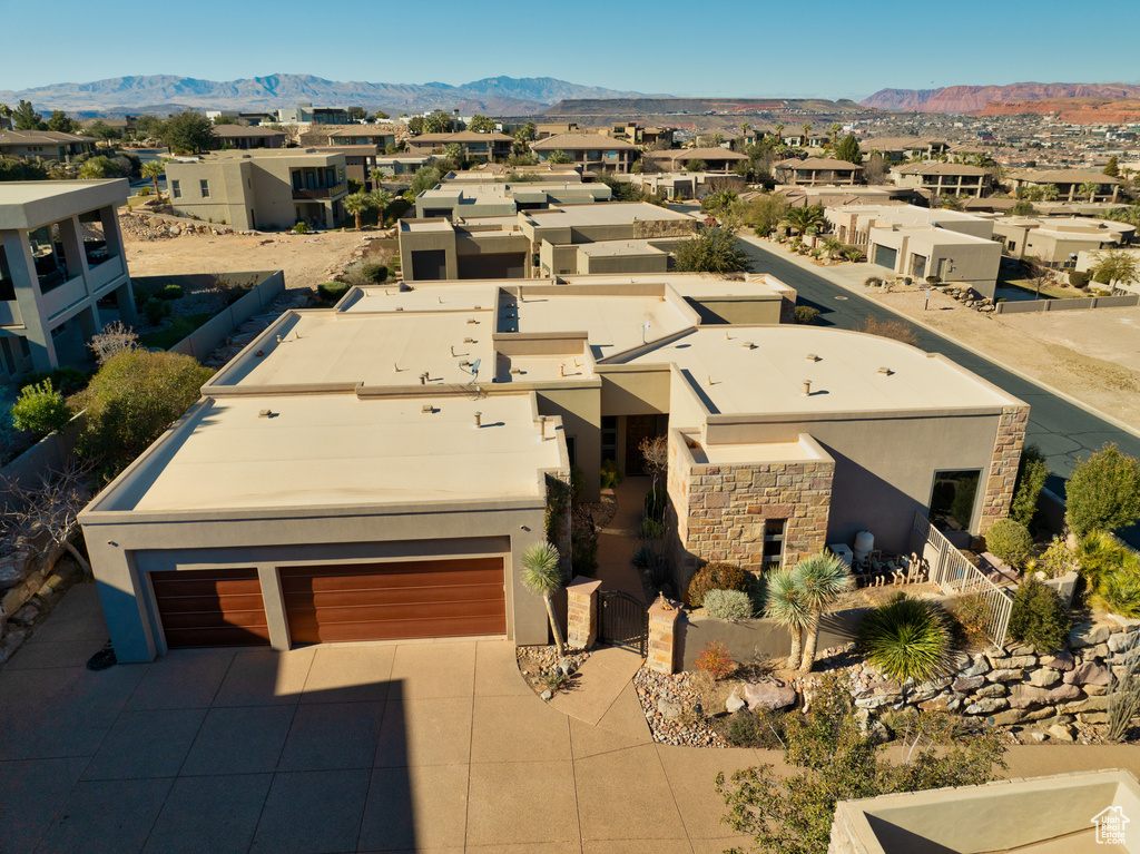 Birds eye view of property with a mountain view