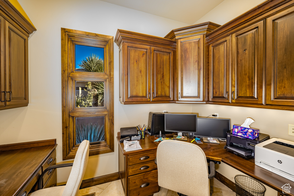 Office area with light tile patterned floors
