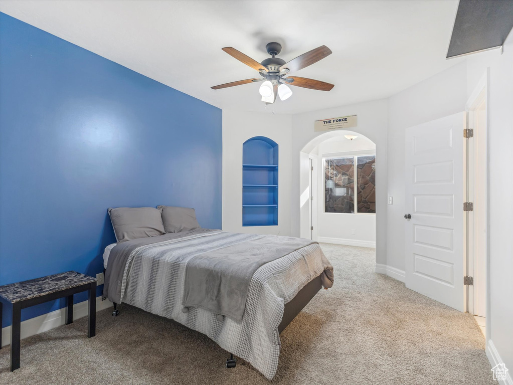 Bedroom featuring ceiling fan and light colored carpet