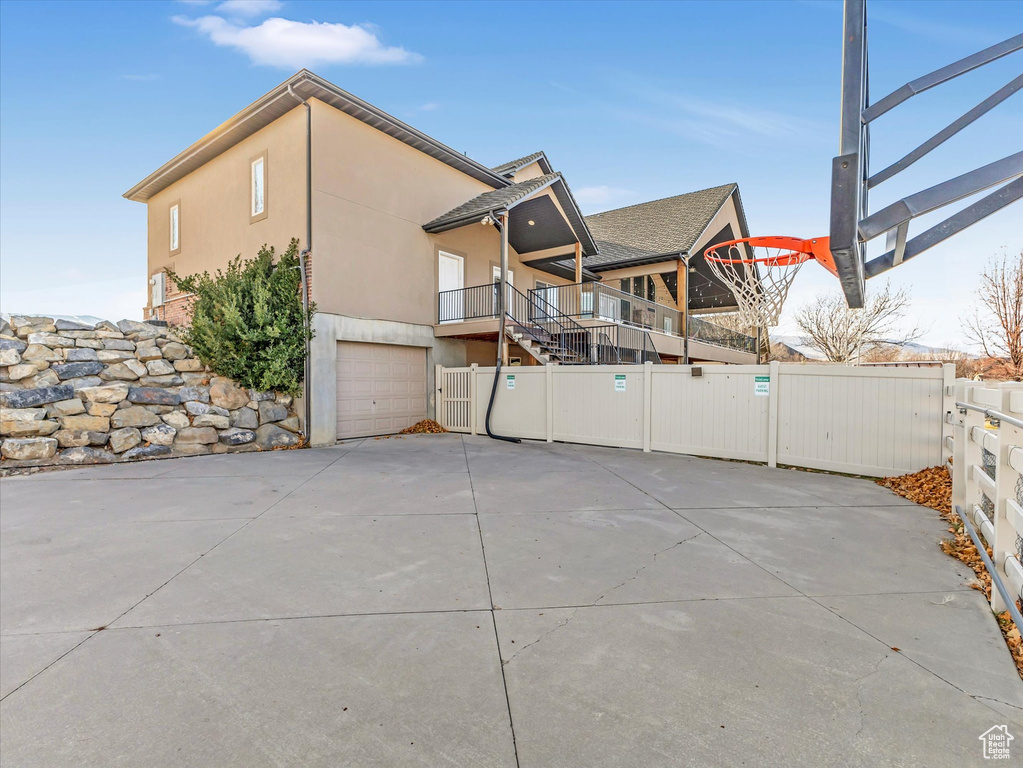View of side of home featuring a garage
