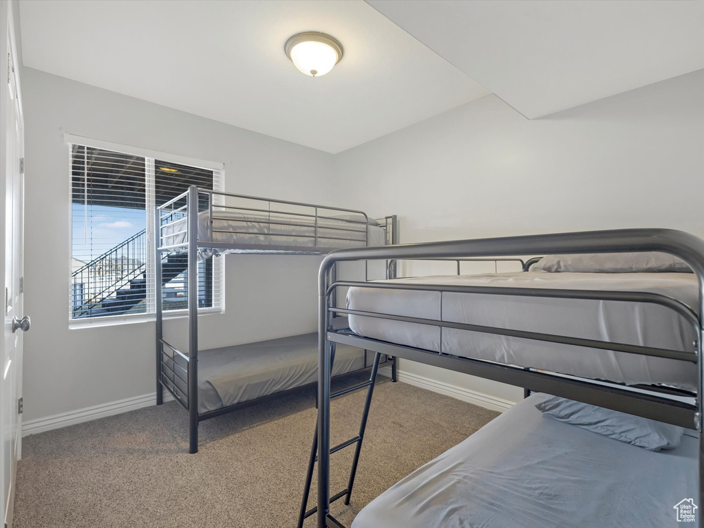 Bedroom with light carpet