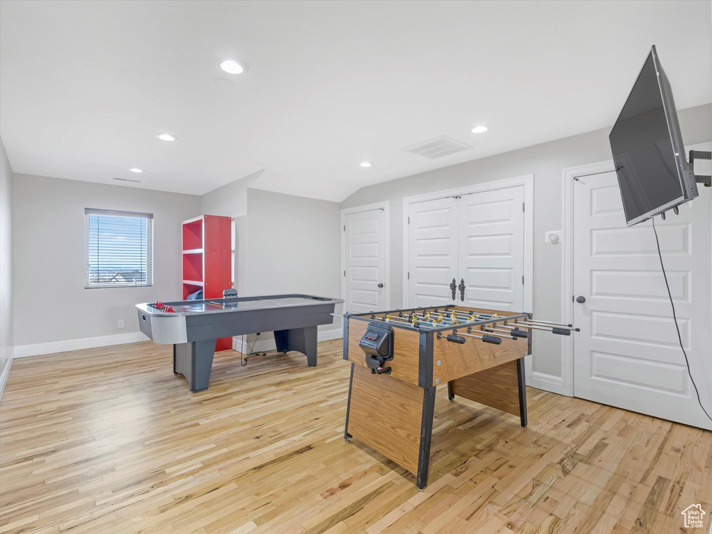 Recreation room featuring light hardwood / wood-style flooring