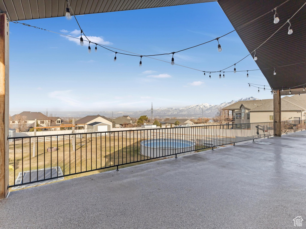 View of patio with a pool and a mountain view