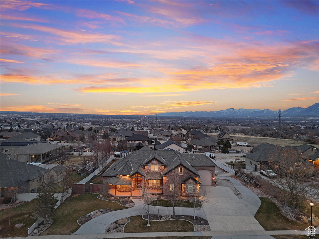 Aerial view at dusk featuring a mountain view
