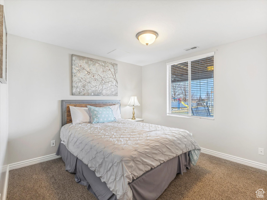 Bedroom with carpet flooring