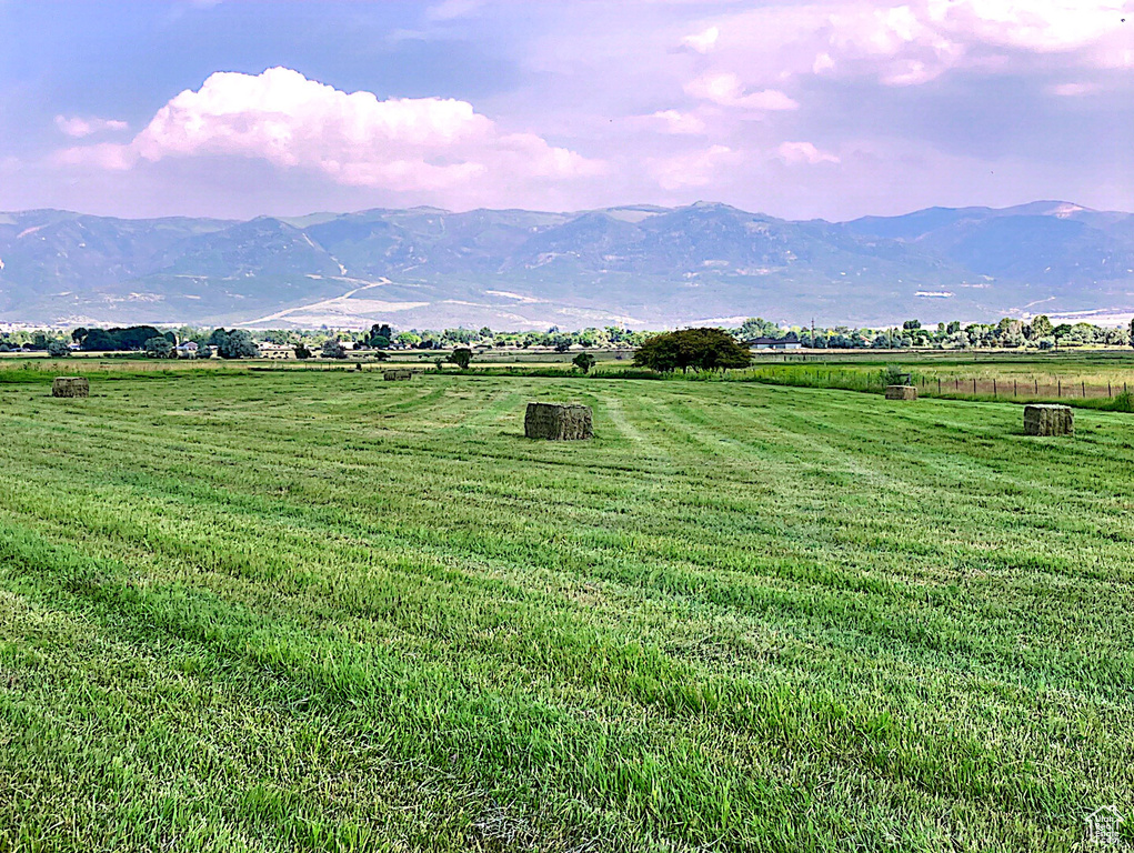 Property view of mountains with a rural view