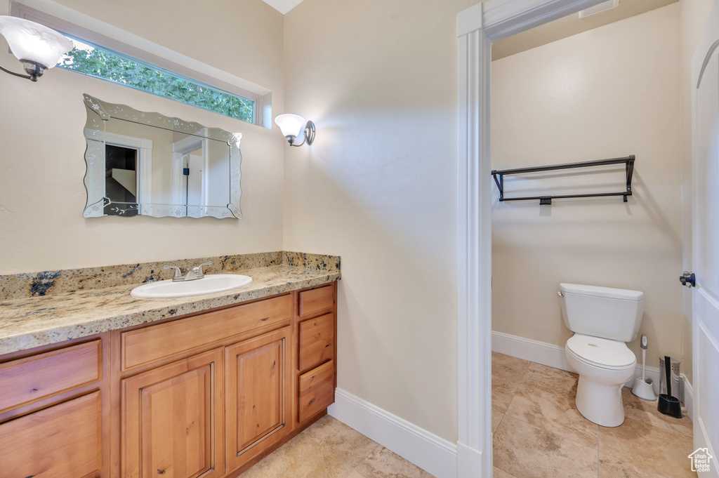 Bathroom with vanity and toilet