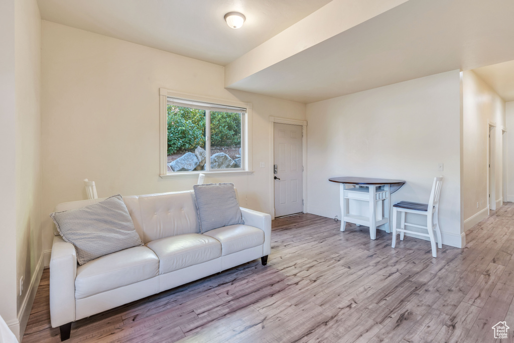 Living room with light hardwood / wood-style flooring