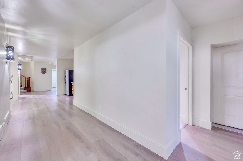 Hall featuring light hardwood / wood-style flooring