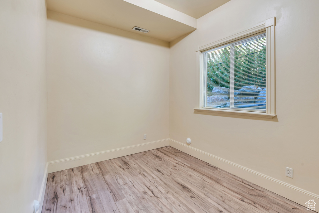 Unfurnished room with light wood-type flooring