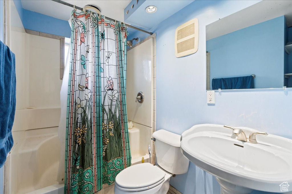 Bathroom featuring sink and toilet