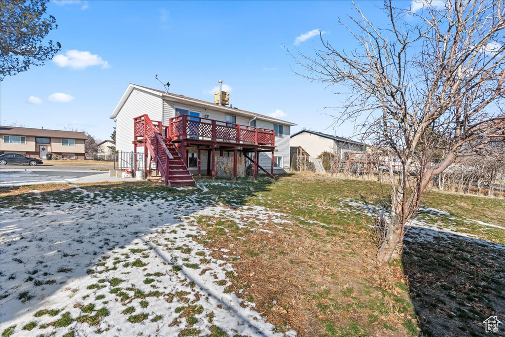 Rear view of property featuring a deck