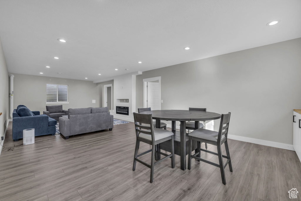 Dining room with light hardwood / wood-style flooring