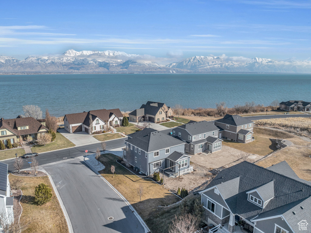 Drone / aerial view with a water and mountain view