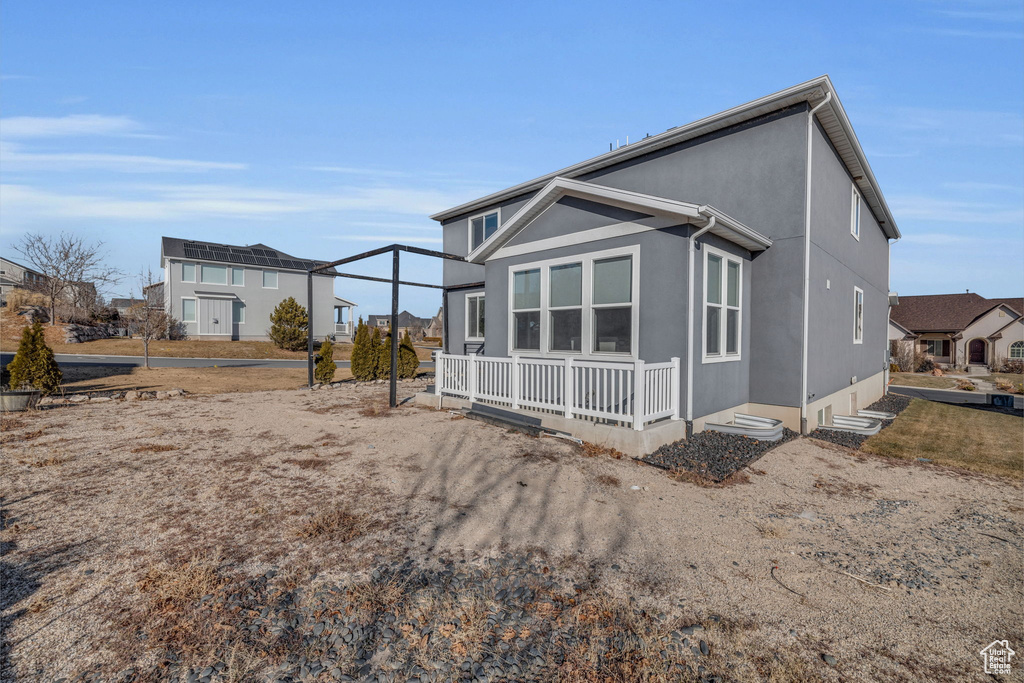 Back of property with covered porch