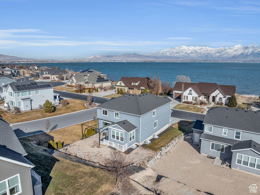 Drone / aerial view with a water and mountain view