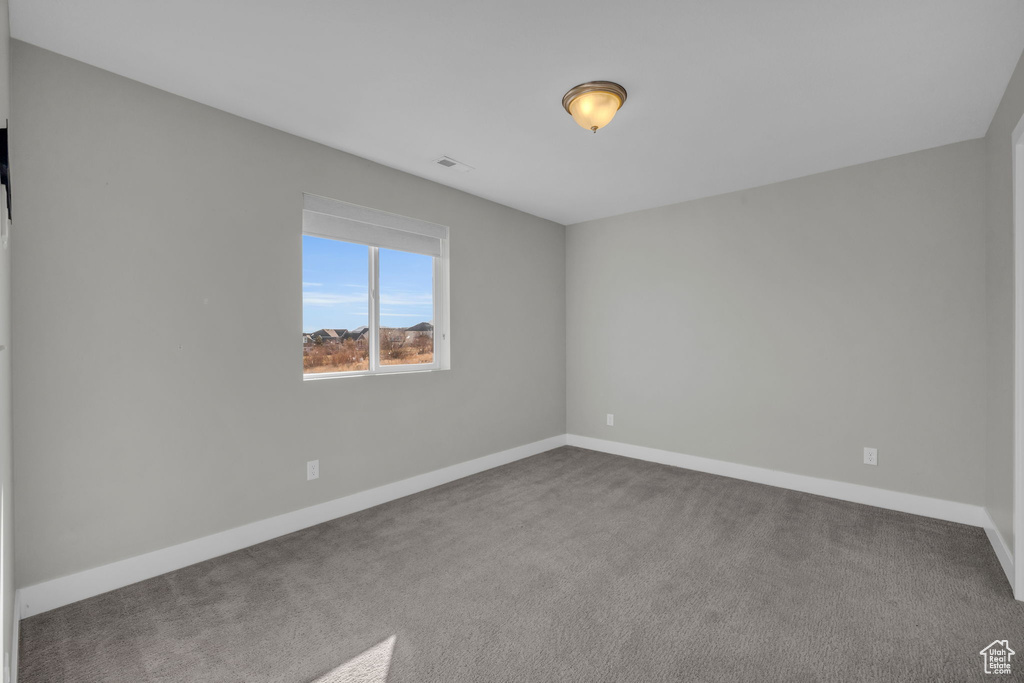 View of carpeted spare room