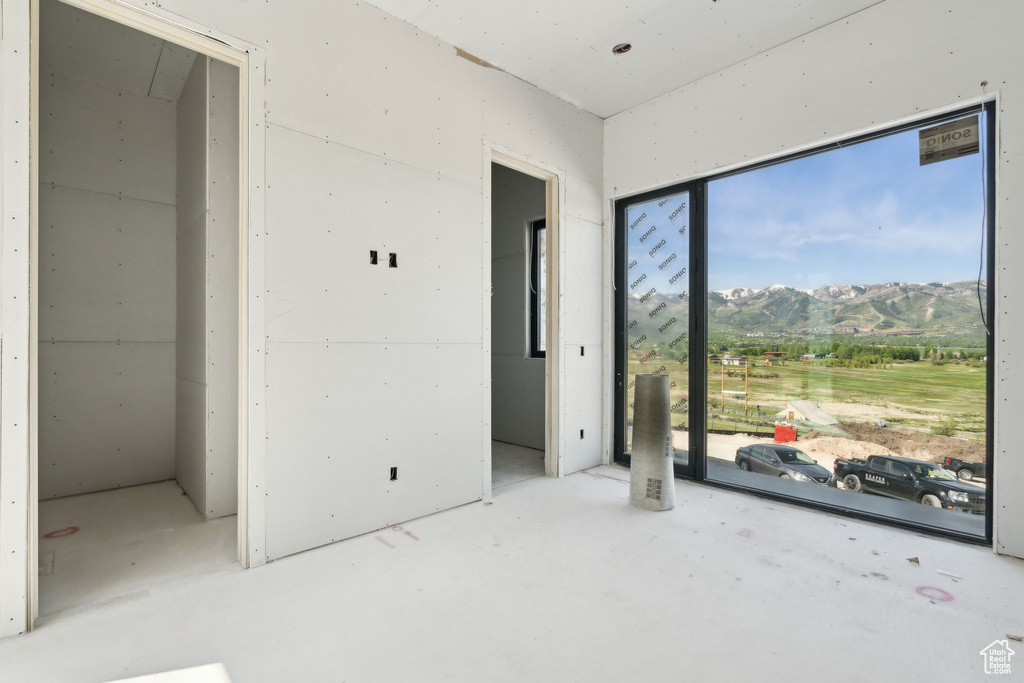 Unfurnished bedroom with a mountain view