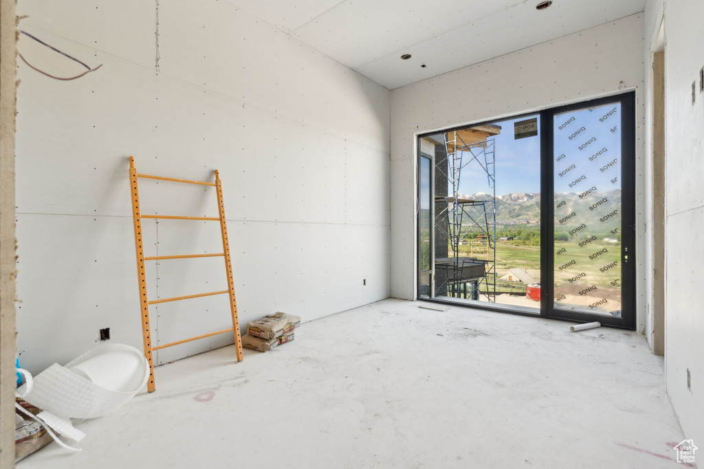 Spare room featuring concrete floors