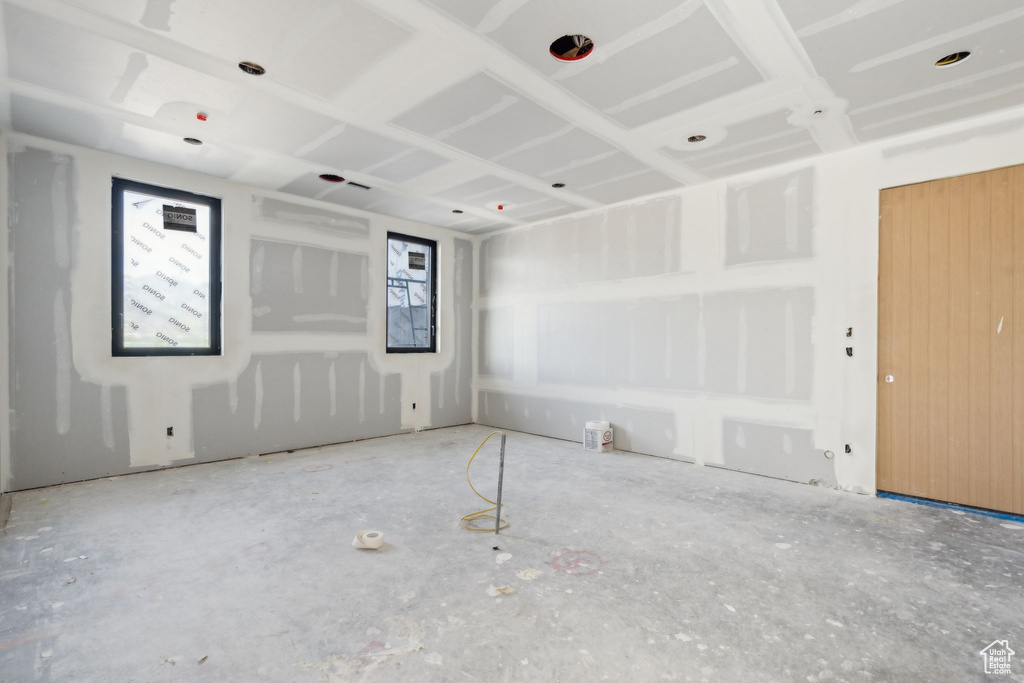 Empty room featuring plenty of natural light