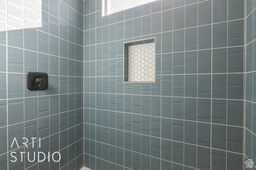 Bathroom featuring tiled shower